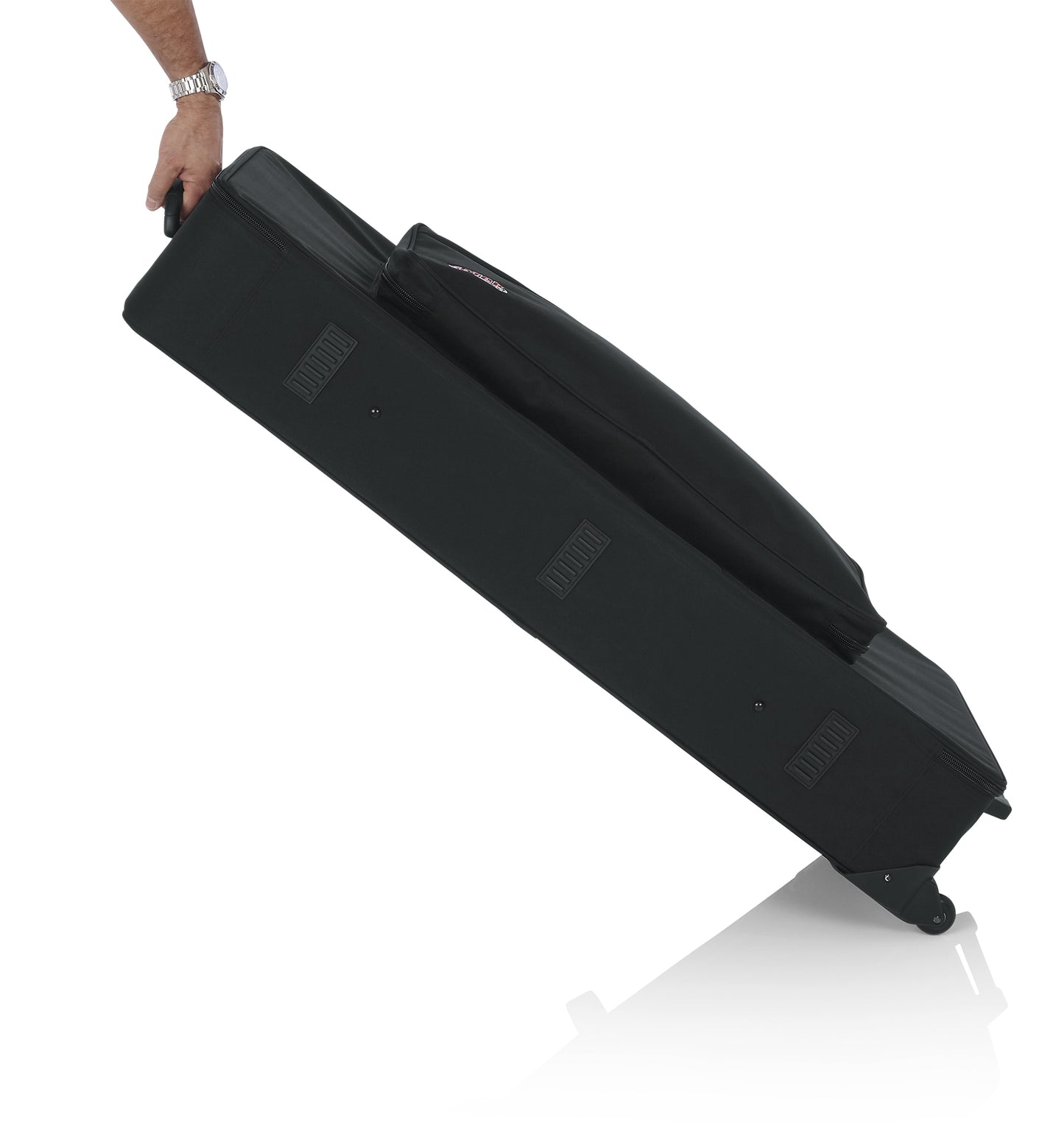 Gator GK-61 keyboard case with built-in wheels and tow handle in use
