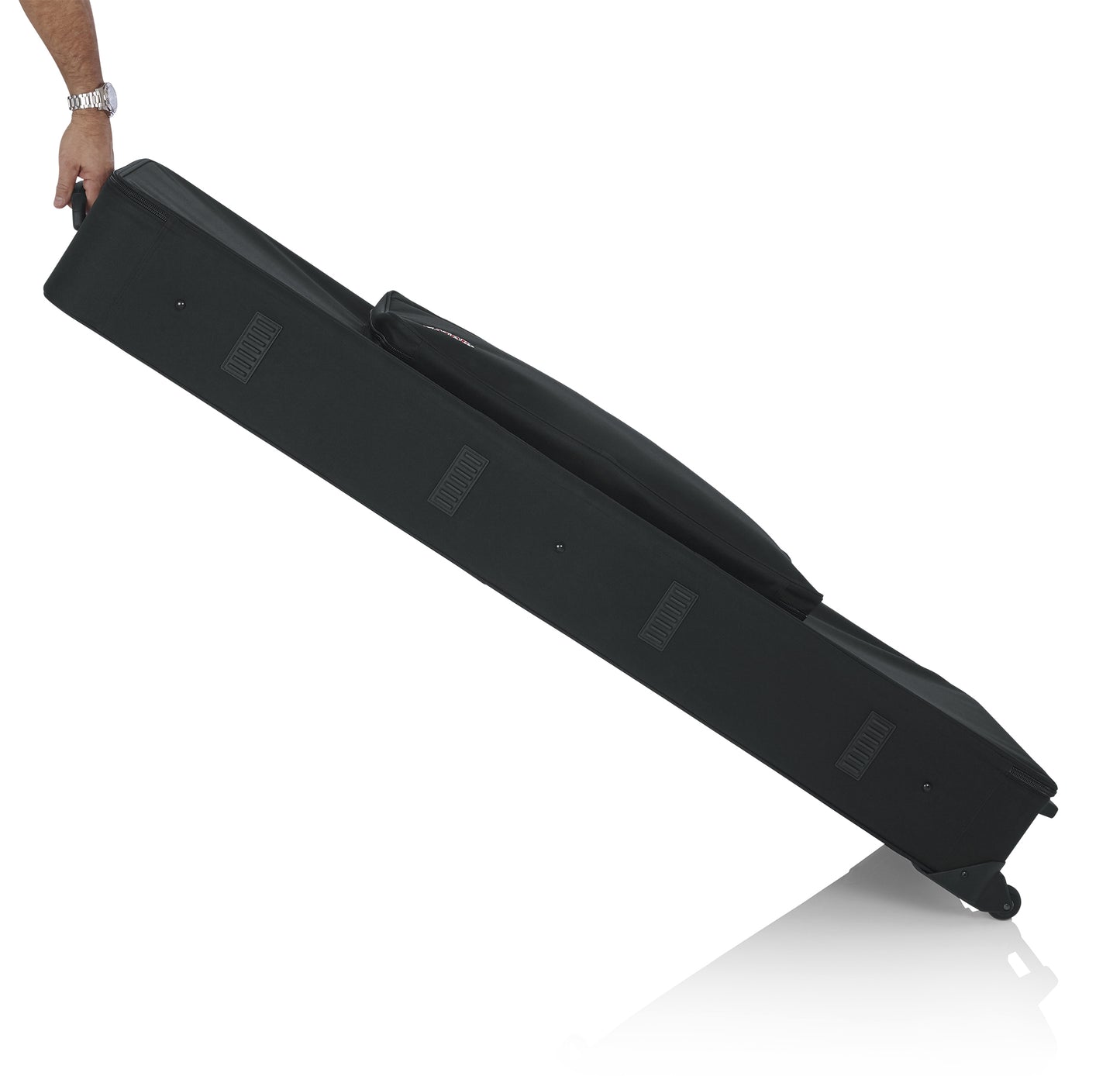 Gator GK-88 keyboard case with built-in wheels and tow handle in use